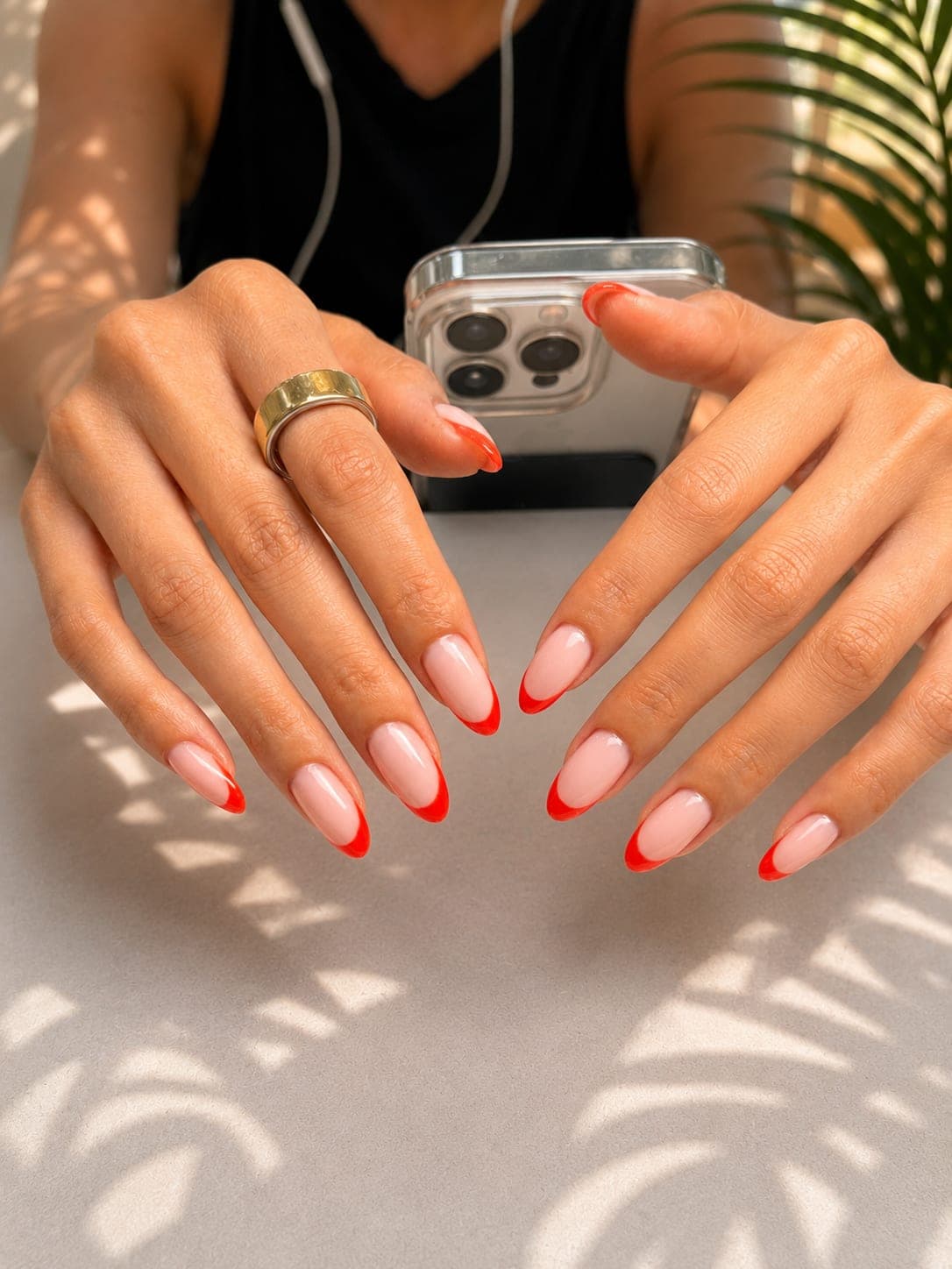 Pink-and-white French manicure on square nails with gold rings