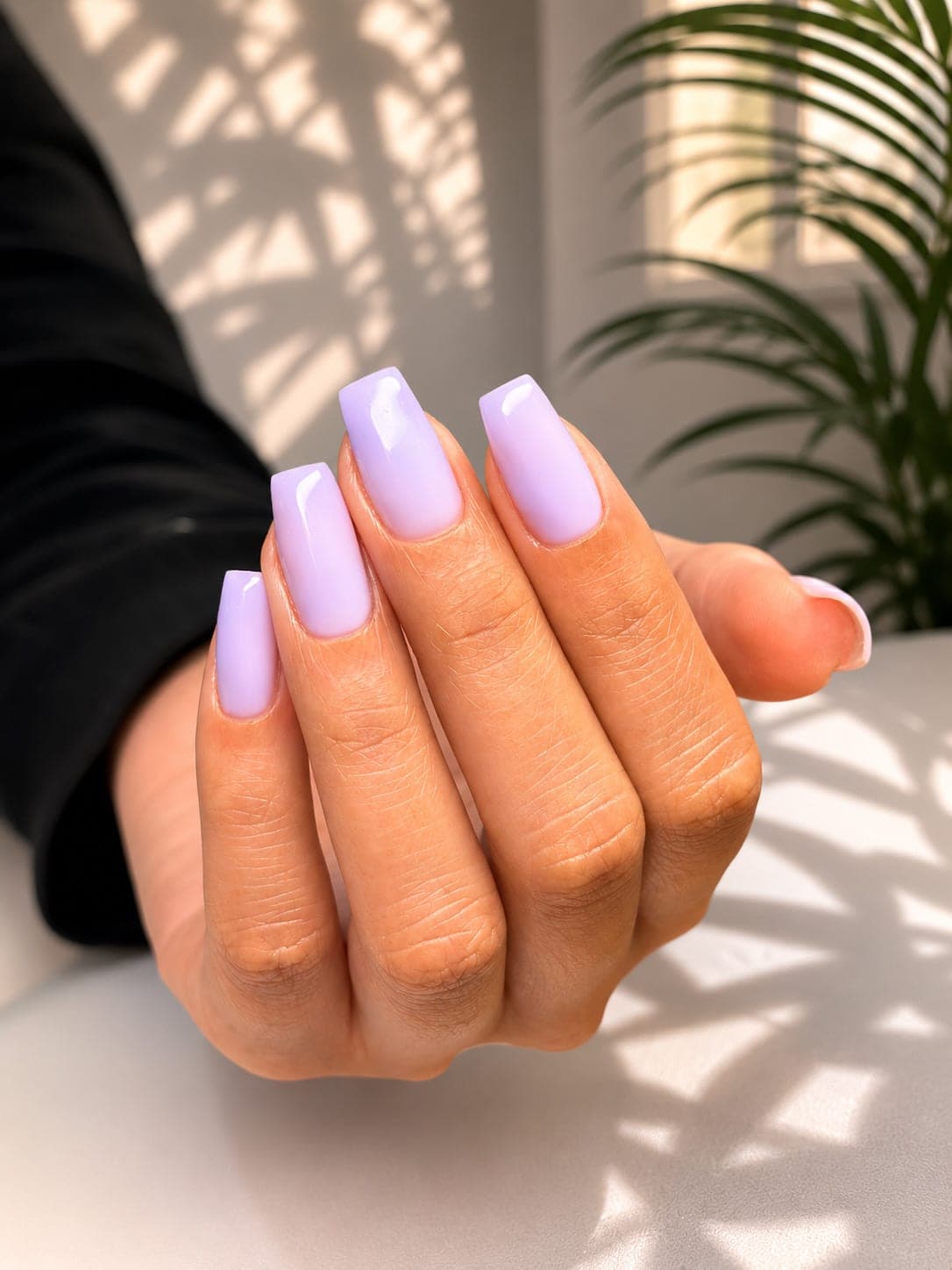 Soft lilac manicure on square nails in sunlight