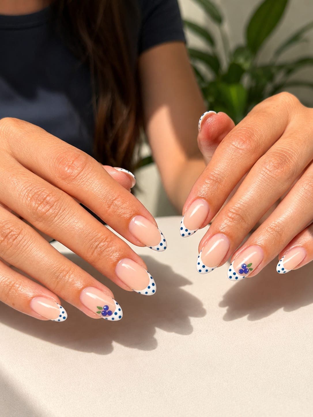 Brown leopard-print French tips on almond nails