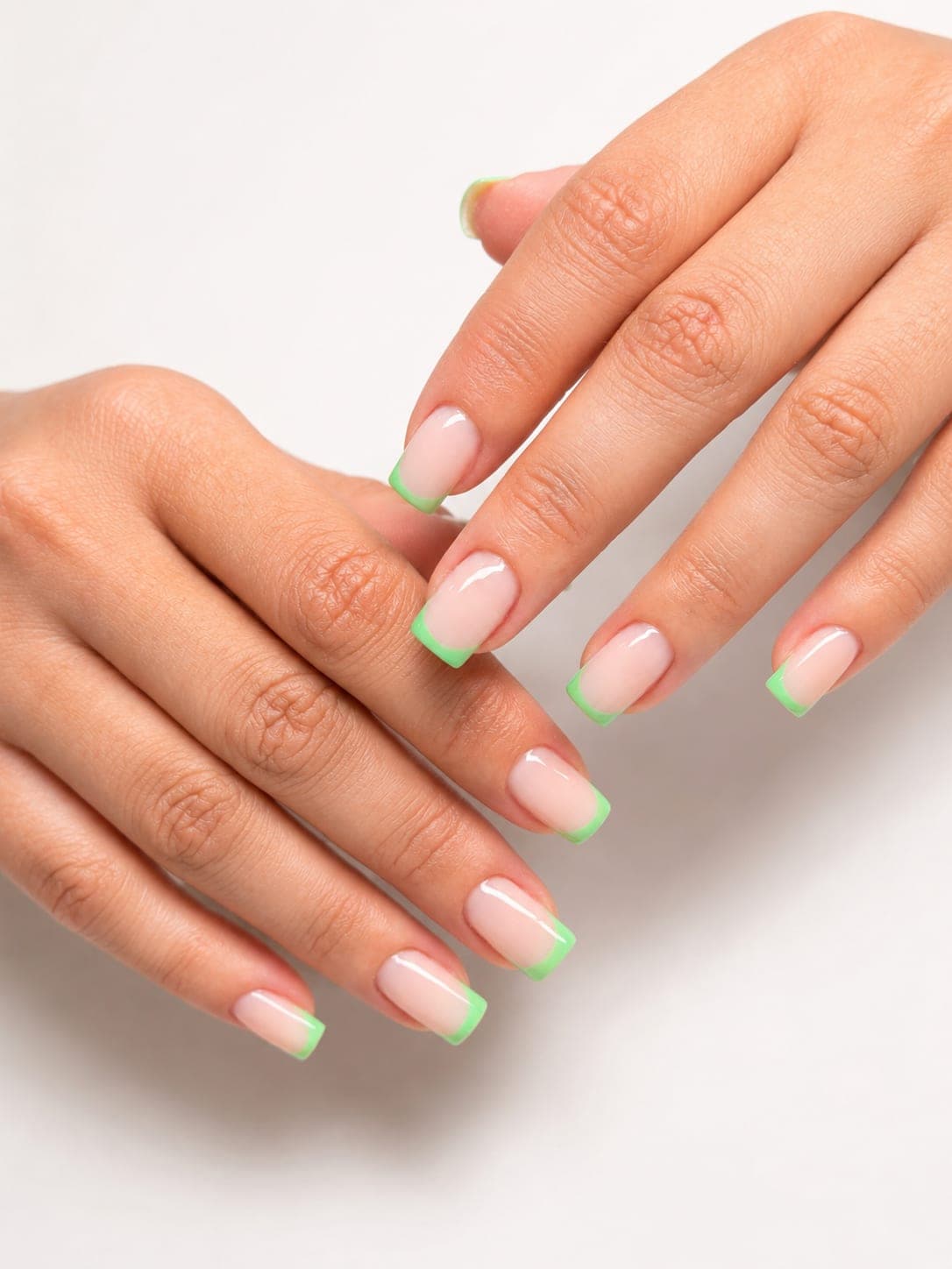Neon green French tips on square nails