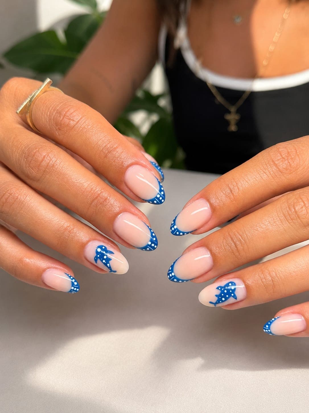 Blue whale-shark nail art with dotted French tips