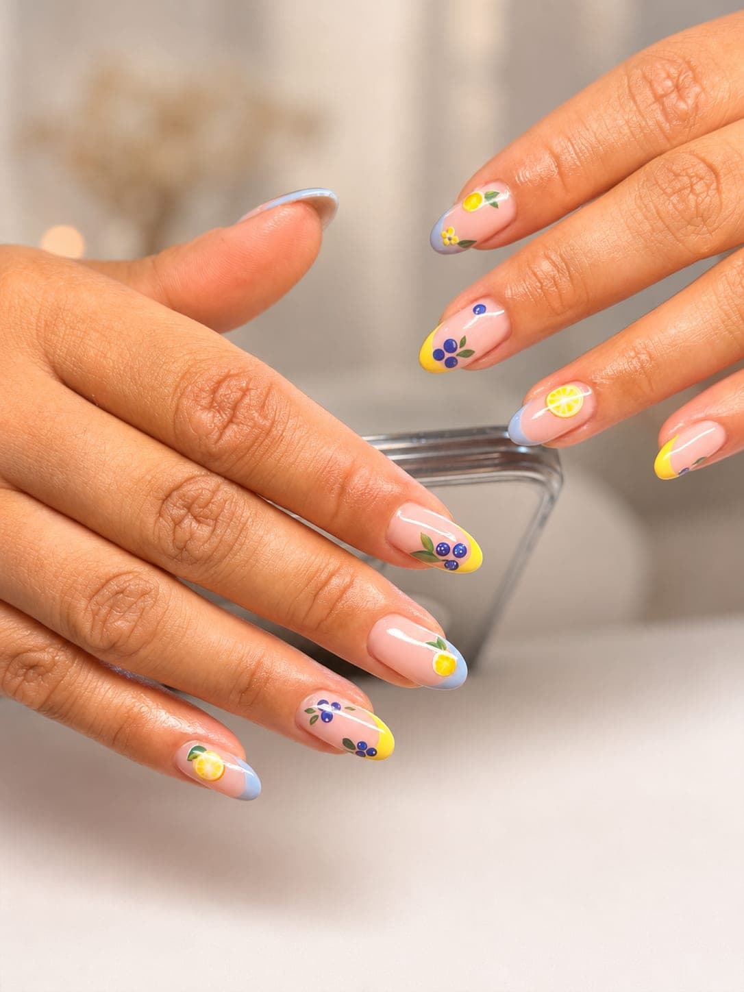 Custom nail design — lemon and blueberry fruit art on French tips